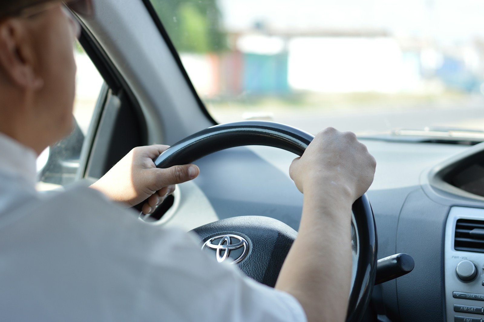 person in white long sleeve shirt driving car, sr-22