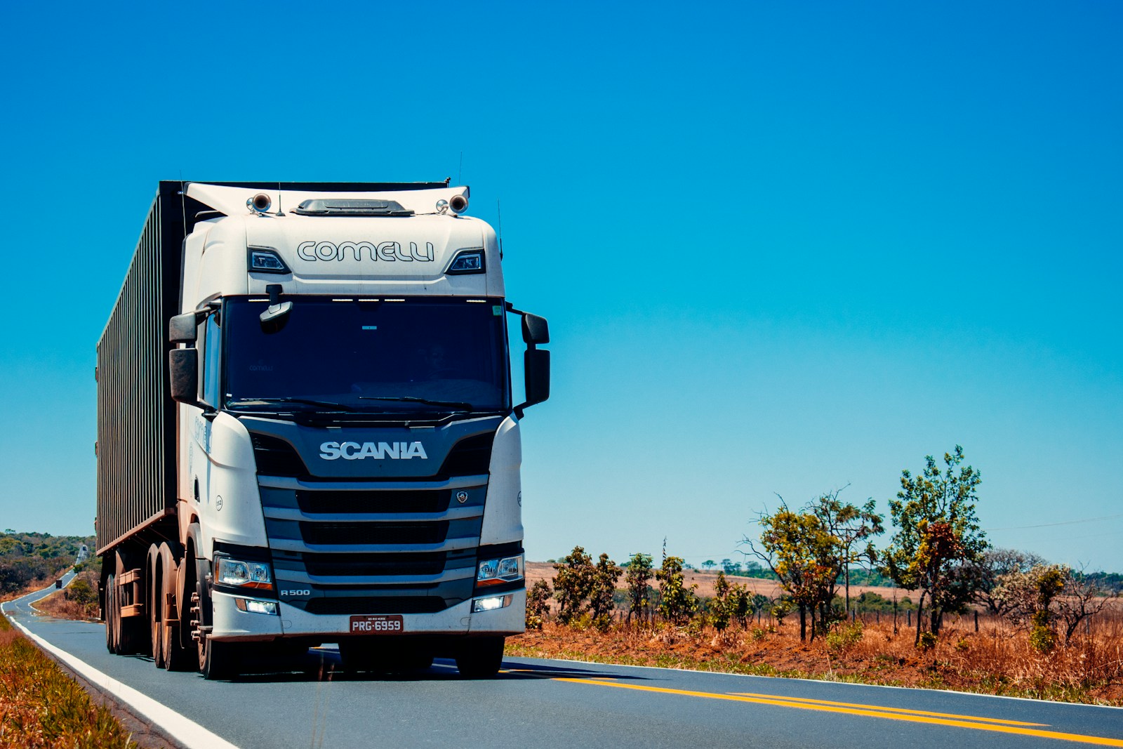 white truck on road during daytime, commercial auto